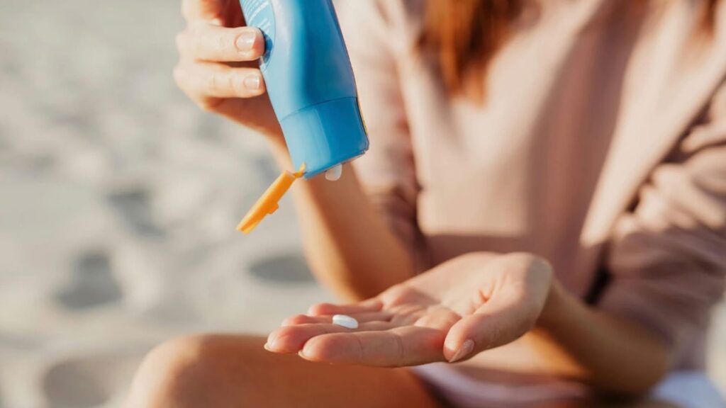 Person Applying Sunscreen for the Article Beat the Heat Not Your Fun