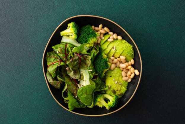 Photo of a bowl of broccoli, and avocado