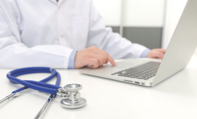 Medical professional on a telehealth consult using a laptop