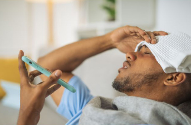 Person suffering from allergic rhinitis on the phone with his healthcare provider