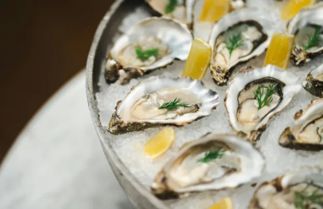 she had enjoyed dinner out which included raw oysters and a fresh salad