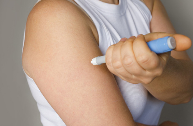 Photo of woman using a GLP-1 injectable